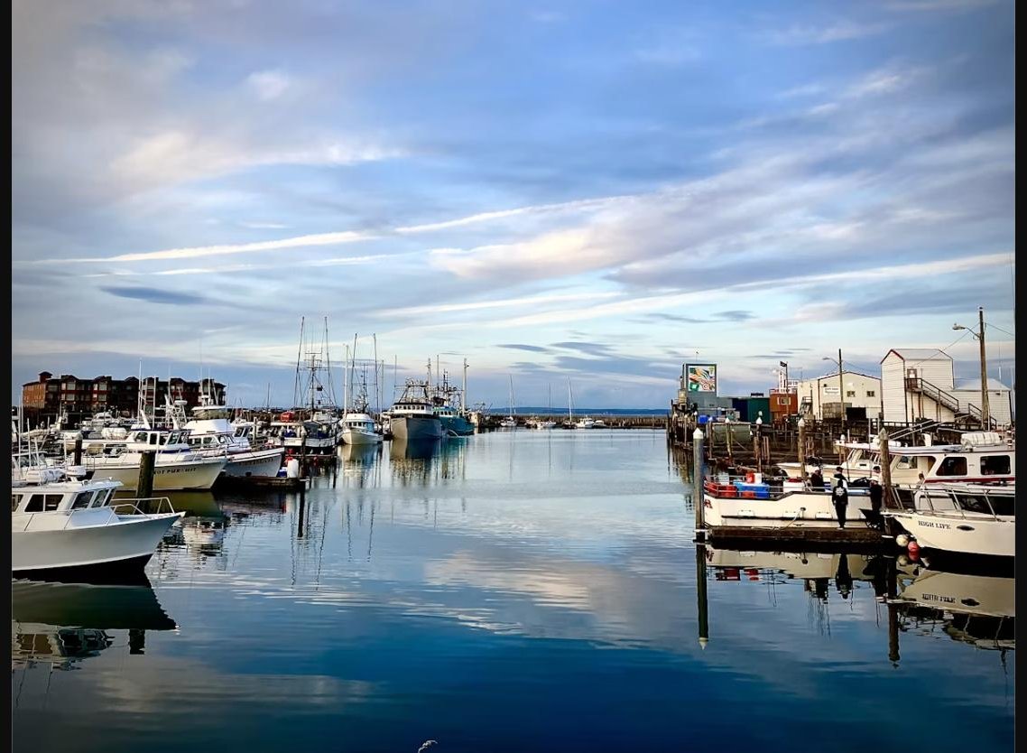 Fishing boats docked in the harbor at Westport, Washington at sunset
